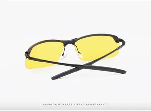 Detailed view of sports driving glasses featuring yellow lenses and black semi-rimless frames