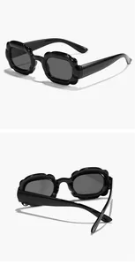 Close-up of black rectangular children sunglasses with scalloped bubble frame design