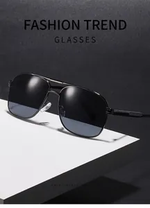 Close-up of retro square double-bridge metal sunglasses with gradient lenses.