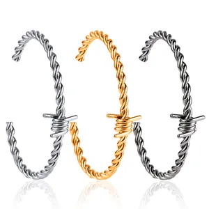 Three-piece set of men's twisted wire barbed wire cuff bracelets in gold, silver, and gunmetal