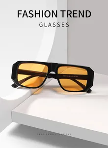 Detailaufnahme einer Vintage-Sonnenbrille mit quadratischem schwarzen Rahmen und orangefarbenen Gläsern