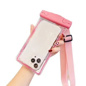 Pink waterproof phone pouch with crossbody strap for swimming and diving