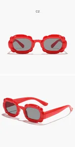 Detailed front and side views of stylish red bubble rectangle sunglasses for kids