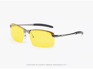 Night vision driving glasses with yellow polarized lenses and a sleek metallic frame