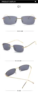 Vintage rimless rectangular sunglasses with gold metal temples and dark grey lenses