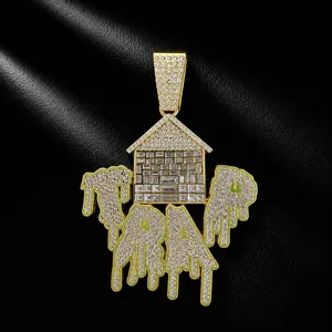Close-up of gold-plated hip-hop TRAP house pendant with iced out dripping oil crystals