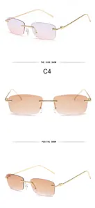 Detailed view of rimless square sunglasses with gold metal temples and gradient lenses