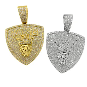 Hip hop iced out lion head shield pendant with KING lettering in gold and silver finish
