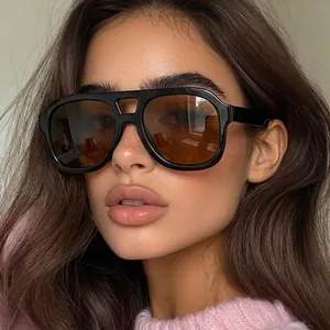 Stylish retro double-bridge large square sunglasses worn by a professional fashion model.