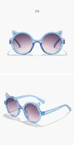 Close-up views of blue glitter cat ear sunglasses for girls with purple gradient lenses
