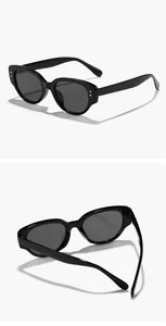 Vue détaillée des lunettes de soleil rétro noires pour enfants montrant la structure