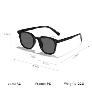 Lunettes de soleil carrées vintage avec monture noire et détails de rivets