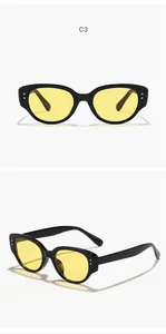 Vue détaillée de lunettes de soleil rétro pour enfants avec verres jaunes et monture noire