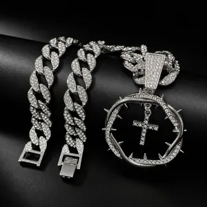 Detailed view of hip hop iced-out Cuban chain with thorn circle cross pendant