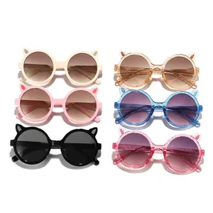 Cute children's round frame sunglasses with decorative cat ear design in multiple colors