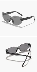 Detailed views showing the unique wavy edge and grey lenses of rimless retro sunglasses