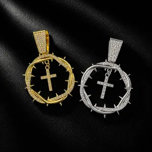 Detailed view of hip-hop iced out thorn ring cross pendants in gold and silver finish