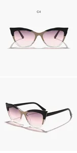 Detailed view of trendy cat-eye sunglasses with two-tone frames and purple gradient lenses