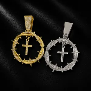 Detail of hip hop alloy pendants with thorns circle and iced out cross in gold and silver