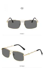 Nahaufnahmen einer quadratischen goldfarbenen Metall-Sonnenbrille mit grauen Gläsern
