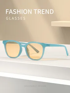 Close-up detail of classic blue square frame sunglasses with yellow lenses