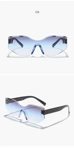 Detailed view of irregular rimless sunglasses with blue gradient lenses
