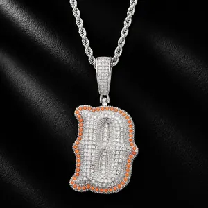Detailed view of hip-hop silver necklace featuring an iced-out D pendant with orange zircon accents