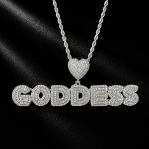 Macro view of iced out GODDESS letter pendant with zirconia stones on rope chain
