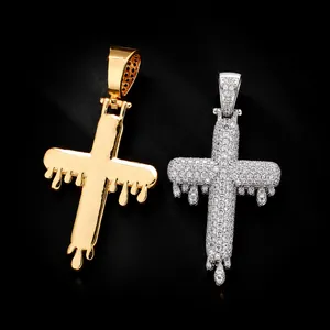 Dripping cross pendants in gold and silver finishes with full zircon pave detailing.