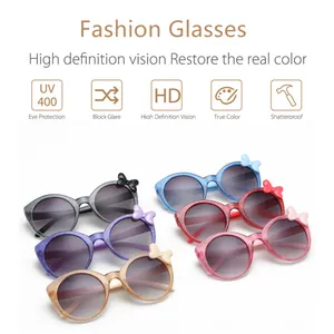 Detail view of colorful glitter round sunglasses for kids with cute butterfly bows