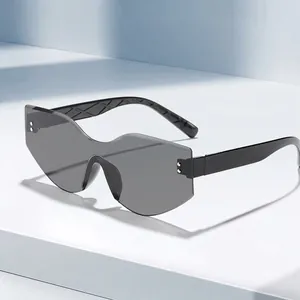 Modern irregular rimless cat eye sunglasses with grey gradient lenses for outdoor wear