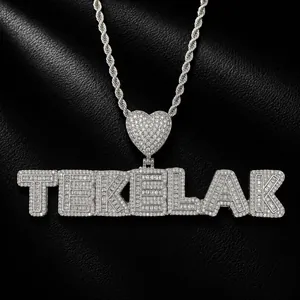 Close-up of iced out custom name pendant necklace with heart shape and sparkling stones