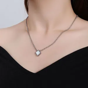 Elegant square white shell pendant necklace crafted in titanium steel worn by model