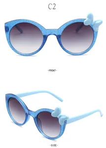 Detailed front and side views of blue sparkly round children's sunglasses with bow detail