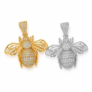 Close-up of hip hop bee pendants featuring iced out zircons and hollow wing designs