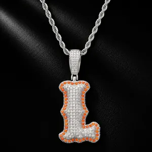 Close-up of hip-hop letter L pendant with orange and clear zircons on silver rope chain