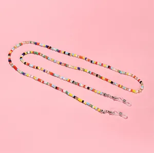 Detailed view of the colorful seed beads and silver lobster clasps on the eyewear strap