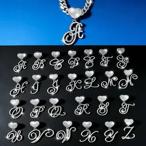 Collection of 26 iced out heart cursive letter pendants with rhinestones for hip-hop style.