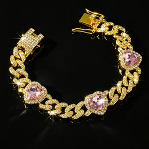Close-up detail of luxury gold cuban link pet collar with sparkling pink heart gems
