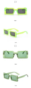Viste dettagliate di occhiali da sole quadrati verde neon e verde oliva da donna.