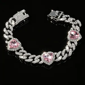Detailed view of iced out cuban link pet collar with sparkling pink heart crystals.