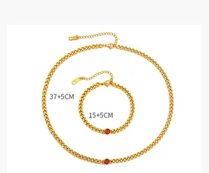 18k gold plated Cuban chain set: 37+5cm necklace and 15+5cm bracelet with red zircon.
