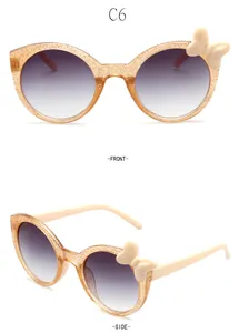 Detailed front and side views of transparent glitter children's sunglasses with cute bow detail