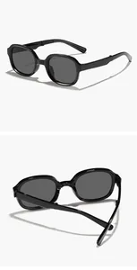 Detailed macro view showing the folding hinge of black retro square frame sunglasses for kids