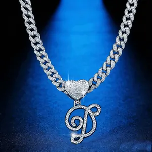 Hip hop iced out Cuban link chain with heart and cursive letter D pendant detail