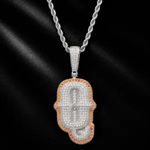 Close-up detail of hip-hop letter pendant with pavé set white and orange crystals