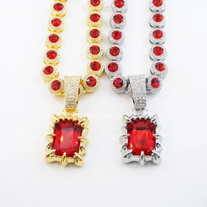 Detailed macro view of vintage gold and silver necklaces with large red ruby pendants