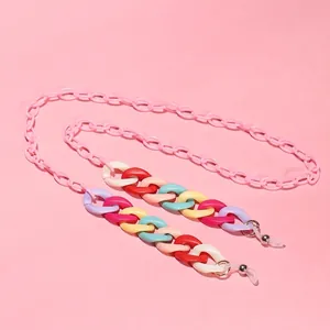 Trendy candy-colored acrylic eyewear chain with vibrant links on a soft pink background