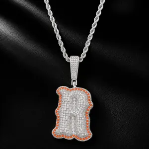 Iced out hip hop bone letter R pendant with orange zircon border on silver rope chain