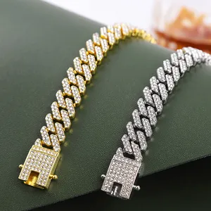 Close-up detail of gold and silver iced-out rhombus Cuban link chains for fashion accessories.